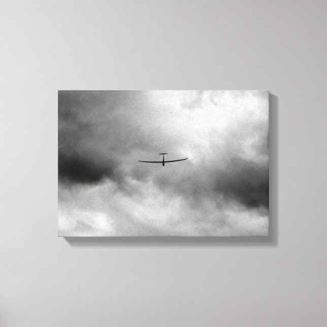 Glider flying in grey sky canvas print (Front)