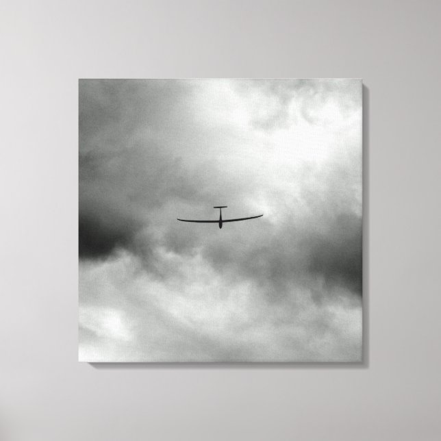 Glider flying in grey sky canvas print (Front)