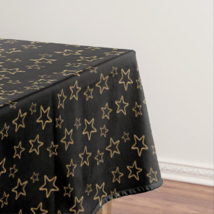Glittering Golden Star Silhouettes on Black Tablecloth