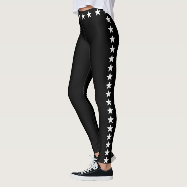 Glittering white stars on black leggings (Left)