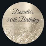 Glittery Champagne Foil 50th Birthday Classic Round Sticker<br><div class="desc">Create your own fancy monogram stylish milestone birthday celebration envelope seals for her. The background features a pale gold brushed metal style foil digital art graphic. Along the bottom is a band of gold faux glitter girly glam. Customise the font colour, size or style. The luxury sparkles, glitter and foil...</div>