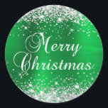 Glittery Silver and Green Foil Merry Christmas Classic Round Sticker<br><div class="desc">Fancy calligraphy Merry Christmas envelope seal stickers for your special holiday greetings or invite.
Girly faux sparkly silver glitter on the top and bottom edge over a faux green brushed metal style ombre foil.
The colour of the old-fashioned text graphic can be changed.</div>