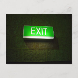 Glowing EXIT sign board on wall Postcard