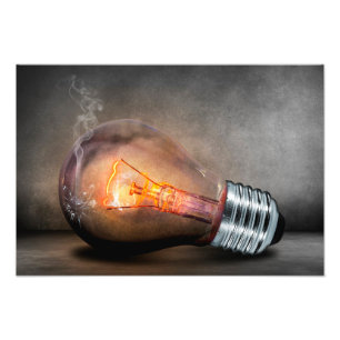 Glowing Light Bulb Cracked Glass Smoke Photo