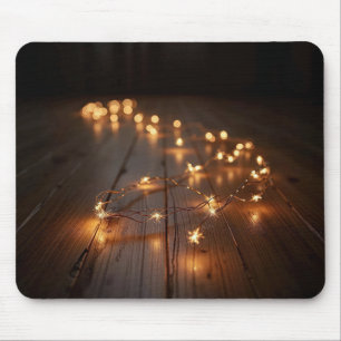 Glowing Light String On a Wood Floor Mouse Mat