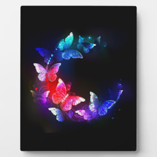 Glowing Neon Night Butterflies on Black background Plaque