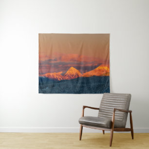 Glowing orange winter mountain range tapestry