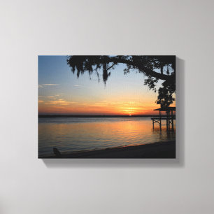 Glowing sunset at the river canvas print