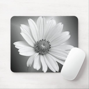 glowing white daisy on black mouse mat