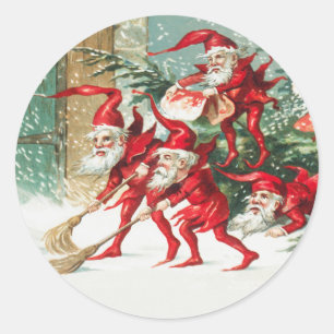 Gnomes sweeping snow with a broom classic round sticker