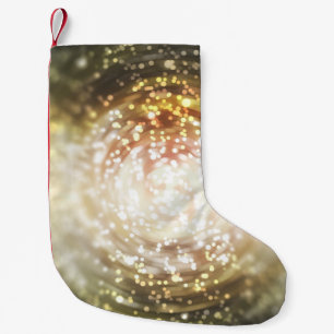gold abstract blur background, with defocused boke small christmas stocking