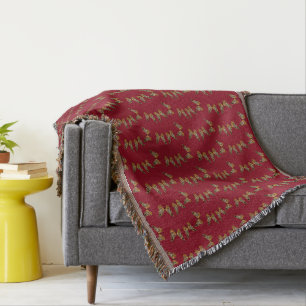 Gold and black butterflies on maroon throw blanket