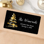 Gold and Black Christmas Tree Label<br><div class="desc">This elegant and chic address label features a gold and black ribbon Christmas tree with presents. The text combines handwritten script and modern sans serif fonts for a classy and sophisticated look. The falling snow, snowflakes and sparkles give a festive and magical touch. This is perfect for Christmas and the...</div>