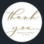 Gold Calligraphy Wedding Thank You Classic Round Sticker<br><div class="desc">Send thanks with this customisable script thank you stickers. It features modern calligraphy and classic typography. Personalise this script thank you sticker by adding your own details. This gold and white thank you card will be perfect for wedding favours and as an envelope seal.</div>