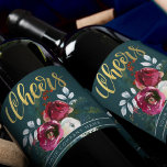 Gold Cheers Winter Roses Christmas Corporate Gift Wine Label<br><div class="desc">Personalised elegant holiday / Christmas seasonal wine label featuring red and white watercolor peony roses with winter foliage,  red berries and fir branches,  "cheers" gold typography script and your company name / custom text on a dark hunter blue green background .          Suitable for Christmas parties,   business / corporate gifts.</div>