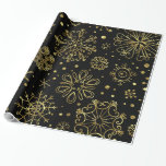 Gold Christmas Snowflakes On Black Wrapping Paper<br><div class="desc">Elegant gold tones christmas abstract snowflakes over back background you can change on the website. Gold snowflakes come with transparent background.</div>