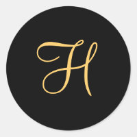 Gold-coloured initial H on black monogram round C