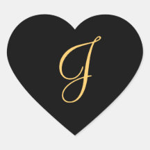 Gold-coloured initial J on black monogram sticker
