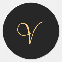 Gold-coloured initial V on black monogram  round