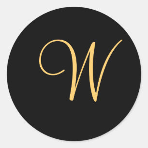 Gold-coloured initial W on black monogram sticker