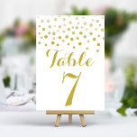 Gold Confetti Elegant Wedding Table Number Card<br><div class="desc">Add a touch of glamour and sparkle to your wedding reception with these elegant table numbers. Featuring a cascade of shimmering gold confetti on a crisp white background,  these cards create a modern and chic look. Easily personalise with your table numbers for a cohesive and unforgettable table setting.</div>