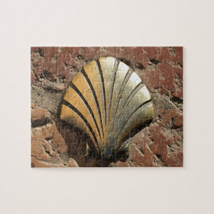 Gold El Camino shell sign, pavement, Leon, Spain Jigsaw Puzzle