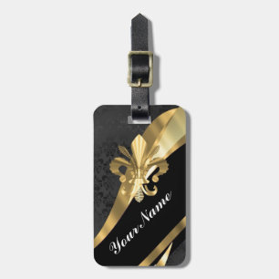 Gold fleur de lys on black luggage tag