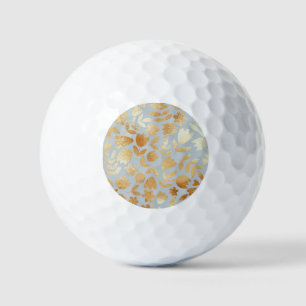Gold flowers, blue background, foil imitation. golf balls