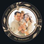 Gold Foliage Family Photo Black Christmas  Classic Round Sticker<br><div class="desc">Modern Elegant Calligraphy Black and Gold Family Photo Merry Christmas Script  Classic Round Sticker. This festive photo holiday design features a pretty faux gold botanical gold leaves with berries,  family name and year in gold script on black colour background.</div>