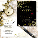 Gold Frills Black Wedding Save the Date Calendar Announcement Postcard<br><div class="desc">This beautiful save the date postcard will give your friends and family advance notice of your upcoming wedding. It features a clever design with a custom calendar where you can put a heart around your wedding date. The background is black, and there are decorative gold faux foil frilly accents in...</div>