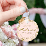 Gold Frills on Pink Bridesmaid Wedding Gift Key Ring<br><div class="desc">These keychains are designed to give as favours to bridesmaids in your wedding party. They feature a simple yet elegant design with a pale blush pink coloured background, gold script lettering, and a lacy golden faux foil floral border. The text says "Bridesmaid" with space for her name, the names of...</div>