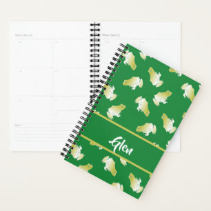 Gold frogs on green planner