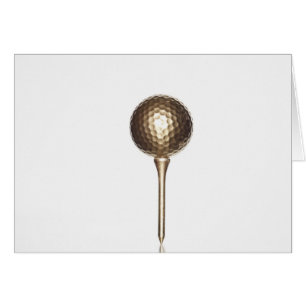 Gold golf ball and tee