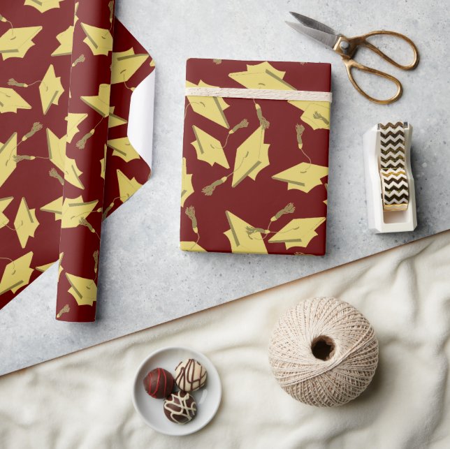 Gold Graduation Caps in the Air on Maroon Party Wrapping Paper (Crafts)