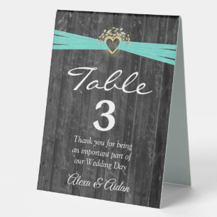 Gold Heart with Turquoise Ribbon On Grey Wood