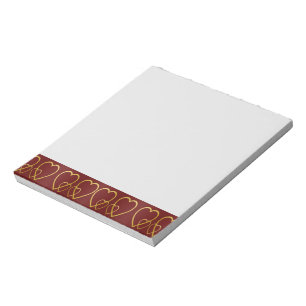 Gold hearts on maroon notepad