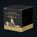 Gold High Heels Glitter Glam Birthday Party Favour Box<br><div class="desc">Elegant personalised square party favour box with gold glitter high heel stiletto shoes and a yellow gold faux glitter border with confetti sprinkles on a black background with custom thank you text, perfect for a modern and chic birthday, bat mitzvah, Quinceañera, bridal shower, baby shower or bachelorette party. USE THE...</div>