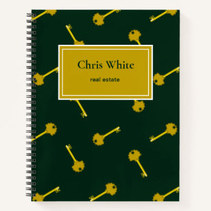 Gold house keys dark green notebook