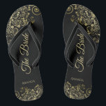 Gold Lace on Black The Bride Elegant Wedding Flip Flops<br><div class="desc">Dance the night away with these beautiful wedding flip flops. Designed for the bride, they feature a simple yet elegant design with gold coloured script lettering on a classic black background and fancy golden lace curls and swirls. Beautiful way to stay fancy and appropriate while giving your feet a break...</div>