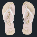 Gold Lace on Blush Pink The Bride Elegant Wedding Flip Flops<br><div class="desc">Dance the night away with these beautiful wedding flip flops. Designed for the bride, they feature a simple yet elegant design with gold coloured script lettering on a light blush pink background and fancy golden lace curls and swirls. Beautiful way to stay fancy and appropriate while giving your feet a...</div>