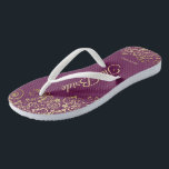 Gold Lace on Cassis Purple The Bride Wedding Flip Flops<br><div class="desc">Dance the night away with these beautiful wedding flip flops. Designed for the bride, they feature a simple yet elegant design with gold coloured script lettering on a cassis purple, magenta, or berry coloured background and fancy golden lace curls and swirls. Beautiful way to stay fancy and appropriate while giving...</div>