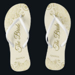 Gold Lace on Ivory Cream The Bride Elegant Wedding Flip Flops<br><div class="desc">Dance the night away with these beautiful wedding flip flops. Designed for the bride, they feature a simple yet elegant design with gold coloured script lettering on an ivory or cream coloured background and fancy golden lace curls and swirls. Beautiful way to stay fancy and appropriate while giving your feet...</div>