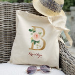 Gold Letter B and Blush Floral Personalised Tote Bag<br><div class="desc">This gold letter B and blush floral personalised wedding tote bag is something your bridesmaids can still use after your wedding day. Get creative by stuffing this cute floral tote bag with your favourite gifts for your bridesmaids, maid of honour, matron of honour, mother of the bride, mother of the...</div>