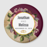 Gold Marble Pattern and Burgundy Florals Wedding Magnet<br><div class="desc">A wedding favour / save the date magnet. Designed with a golden marble pattern and a solid burgundy colour layered diagonally together. A circle with a faux gold foil border which is layered over a pretty floral bouquet with roses, carnations and other flowers. A pair of wedding rings inside the...</div>