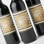 Gold Merry Christmas Black White Stripes Wine Label<br><div class="desc">Merry Christmas in chic white lettering on a splash of faux gold foil,  these wine bottle labels feature a background of modern gold squiggles over black and white stripes and gold dots. Personalised with your name. MATCHING paper plates,  napkins and MORE designs in our store.</div>