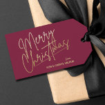 Gold Merry Christmas Luxe Cranberry Gift Tags<br><div class="desc">Merry Christmas in a faux gold foil script and your names in chic lettering,  these cranberry gift tags or party favour tags are stylish for any Christmas holiday occasion.</div>