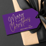 Gold Merry Christmas Luxe Purple Gift Tags<br><div class="desc">Merry Christmas in a faux gold foil script and your names in chic lettering,  these purple gift tags or party favour tags are stylish for any Christmas holiday occasion.</div>