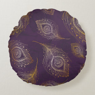 Gold peacock feather in violet background round cushion