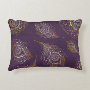 Gold peacock feather, violet background. decorative cushion