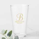 Gold Personalised Monogram and Name Bridesmaid Glass<br><div class="desc">Classic White and Gold Personalised Bridesmaid Glass featuring personalised monogram in gold elegant script font style with bridesmaid's name and title in gold classic serif font style. Also perfect for maid of honour, mother of the bride and more. Please Note: The foil details are simulated in the artwork. No actual...</div>
